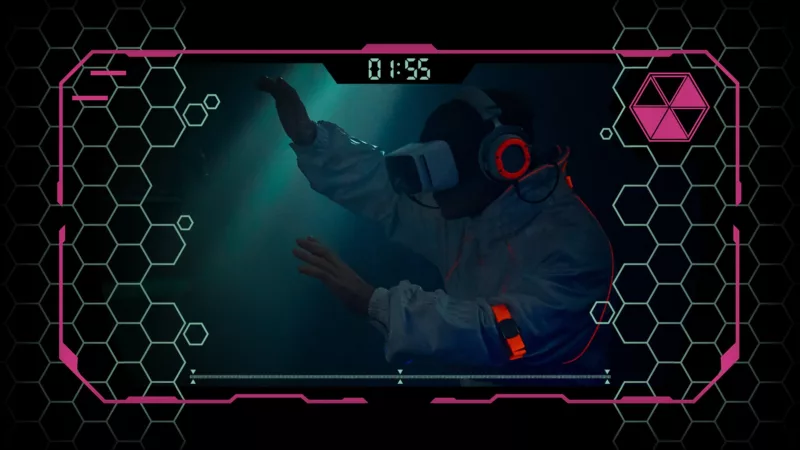 Video still. A person in overalls wears VR glasses and headphones. The headphones and a bracelet glow red. The image has a frame similar to a computer game. Above the person's head "01:55" is displayed.