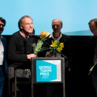 The Ligna group during their acceptance speech - with flowers in their hands.