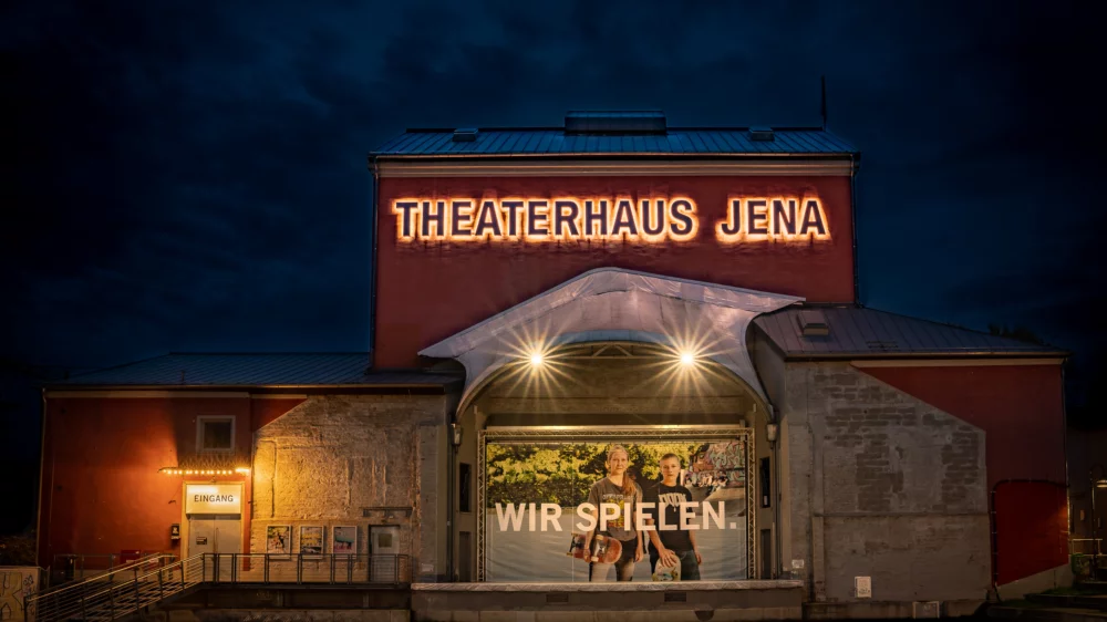 Exterior view of the theater building by night